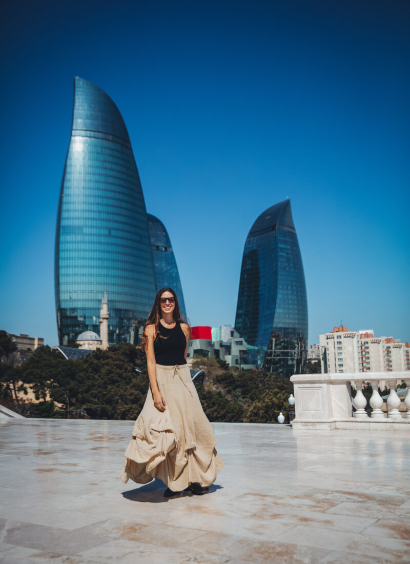 girl in front of the flame towers baku