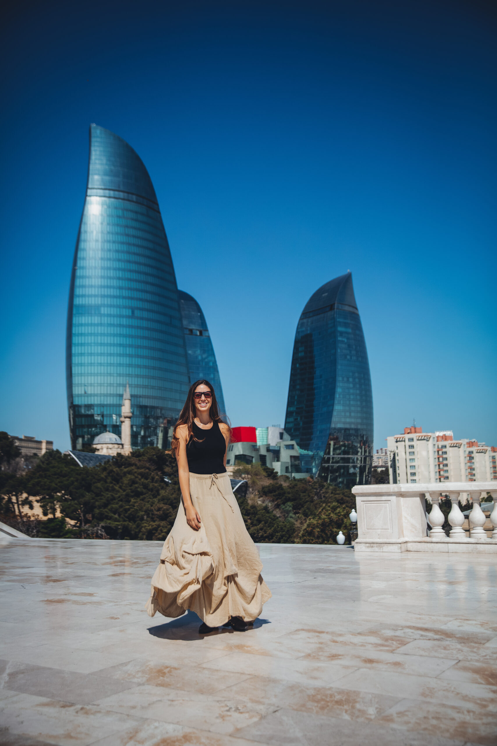 girl in front of the flame towers baku